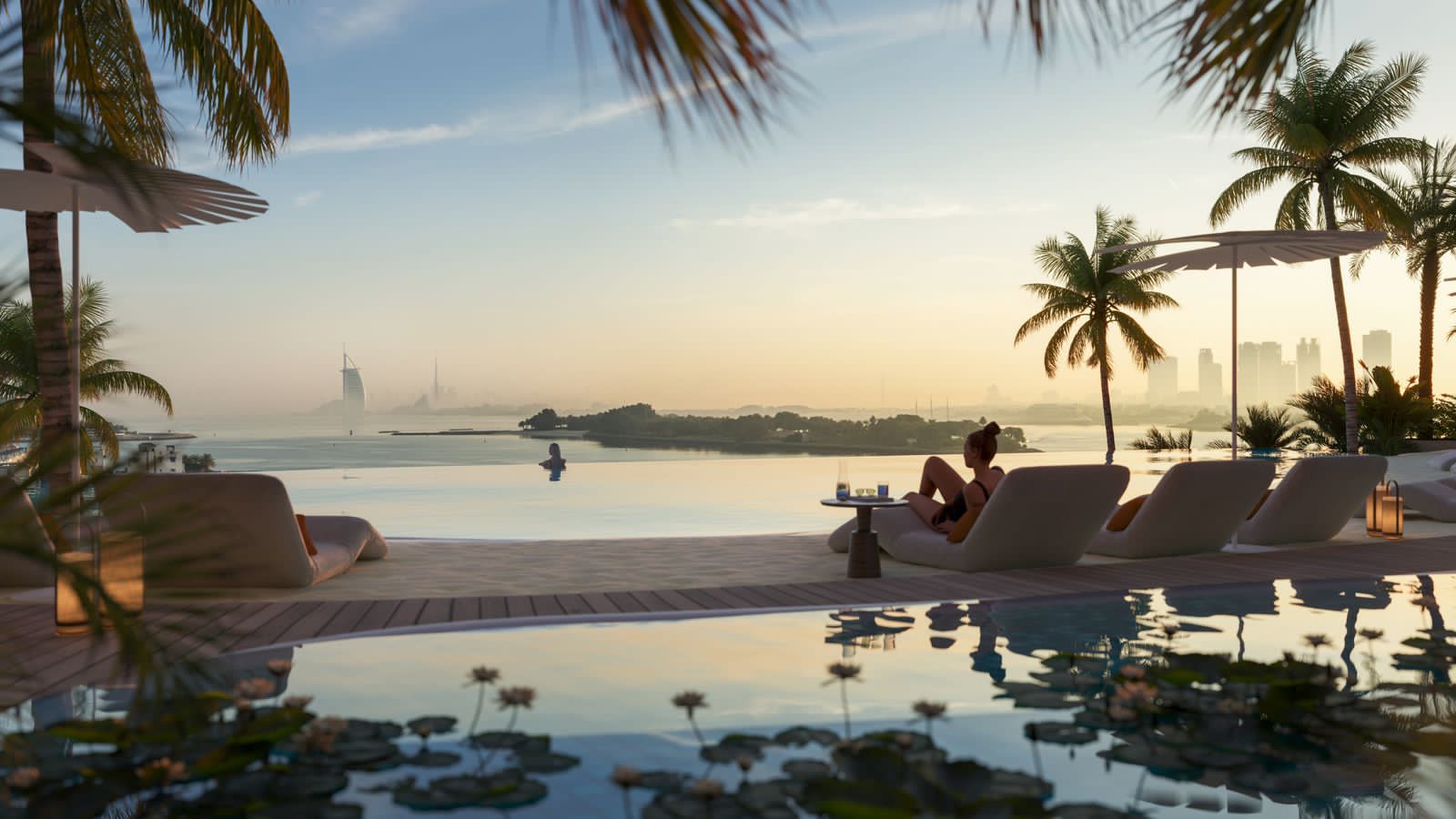 Infinity pool at sunset with Burj Al Arab on the horizon